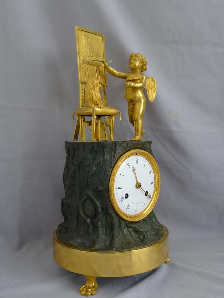 Fine French Empire Genre clock of Cupid as Artist by Maniere.