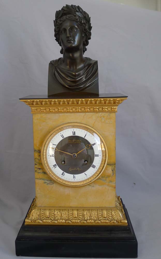 Antique French Charles X patinated bronze,ormolu and black marble clock with bust of Apollo.