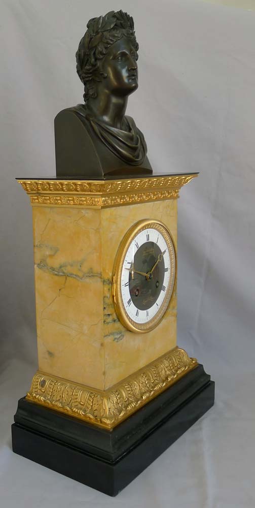 Antique French Charles X patinated bronze,ormolu and black marble clock with bust of Apollo.