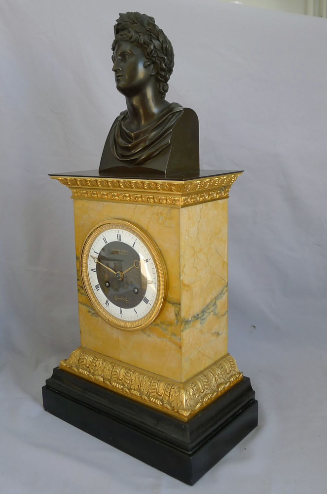 Antique French Charles X patinated bronze,ormolu and black marble clock with bust of Apollo.