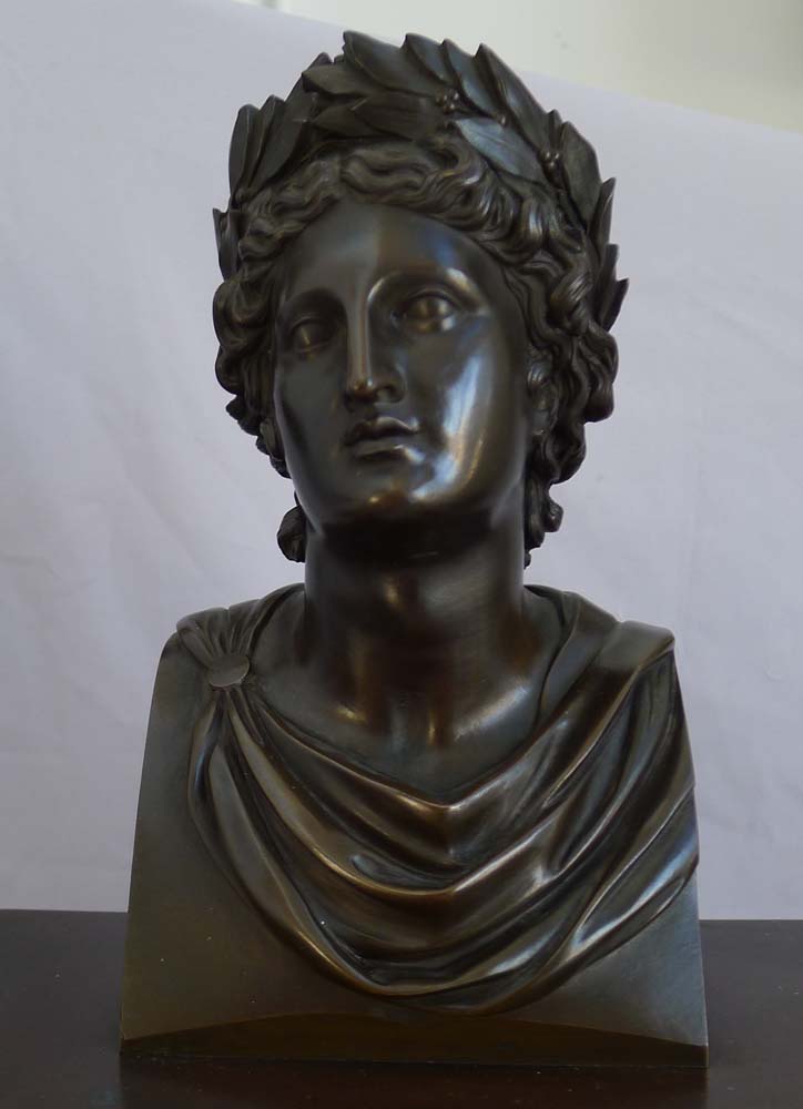Antique French Charles X patinated bronze,ormolu and black marble clock with bust of Apollo.