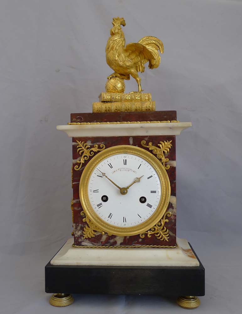 Antique French Directoire mantel clock by Gaston Jolly with Frenchcockerel standing on books.