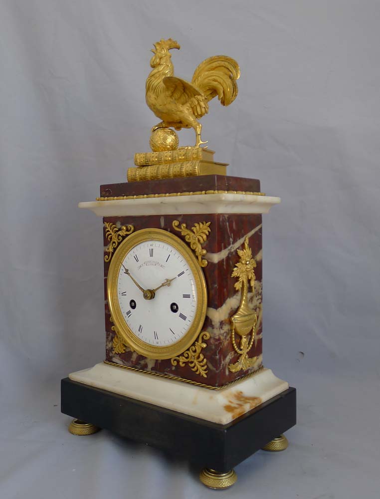 Antique French Directoire mantel clock by Gaston Jolly with Frenchcockerel standing on books.