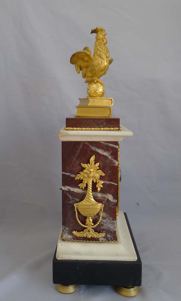 Antique French Directoire mantel clock by Gaston Jolly with Frenchcockerel standing on books.
