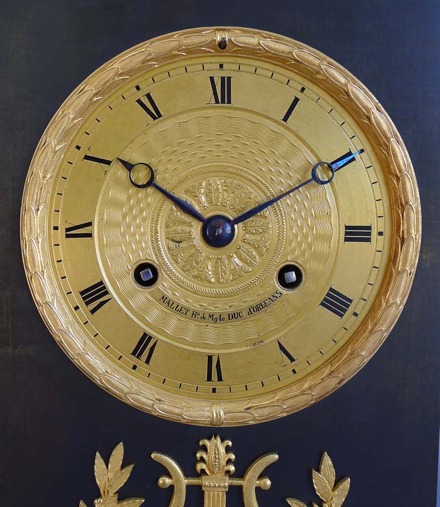 Antique French Charles X period mantel clock in ormolu and patinated bronze
