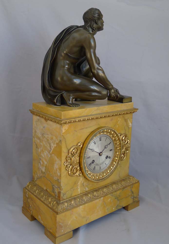Antique French Sienna marble clock with patinated bronze Grand Tour sculpture of The Arrotino.