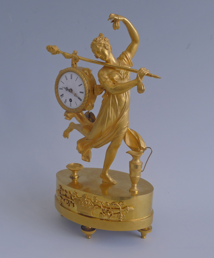 Antique French Empire miniature mantel clock of a dancing bacchante in ormolu