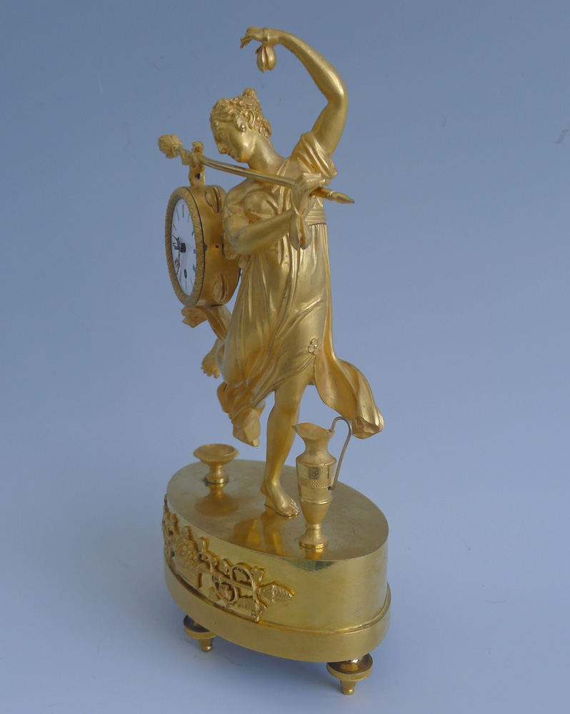 Antique French Empire miniature mantel clock of a dancing bacchante in ormolu