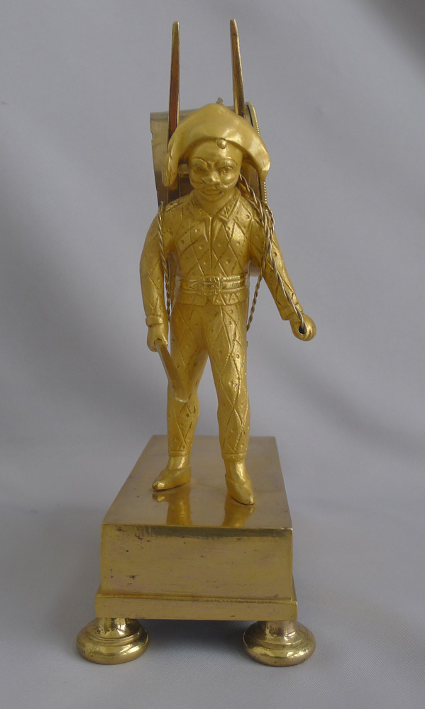 French Empire antique Ormolu clock of Harlequin as a street porter carrying time