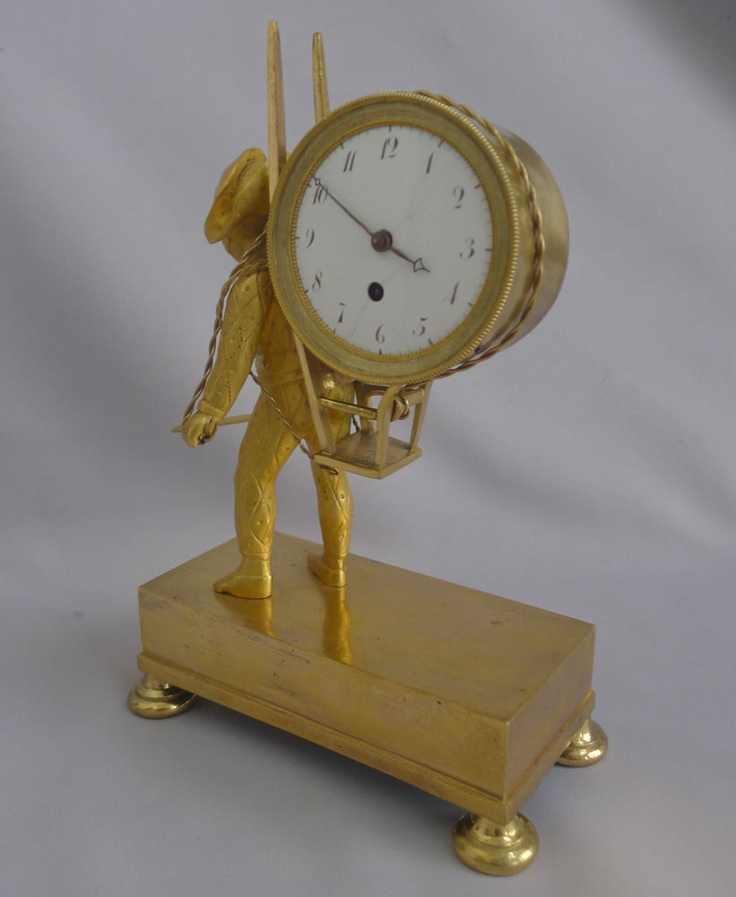 French Empire antique Ormolu clock of Harlequin as a street porter carrying time