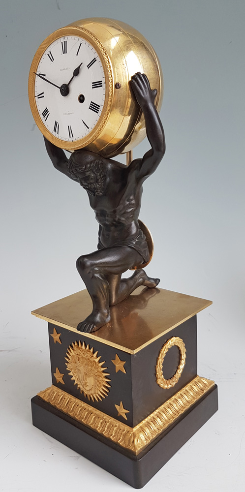 English Regency Ormolu and Patinated bronze mantel clock of Atlas holding the world by Roskell