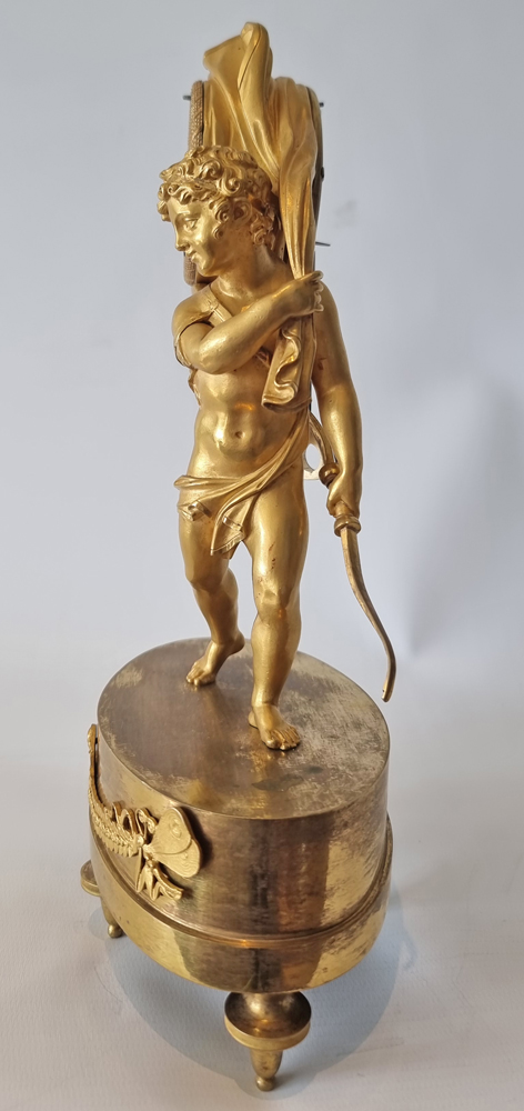 Antique French Empire miniature mantel clock of Cupid carrying time