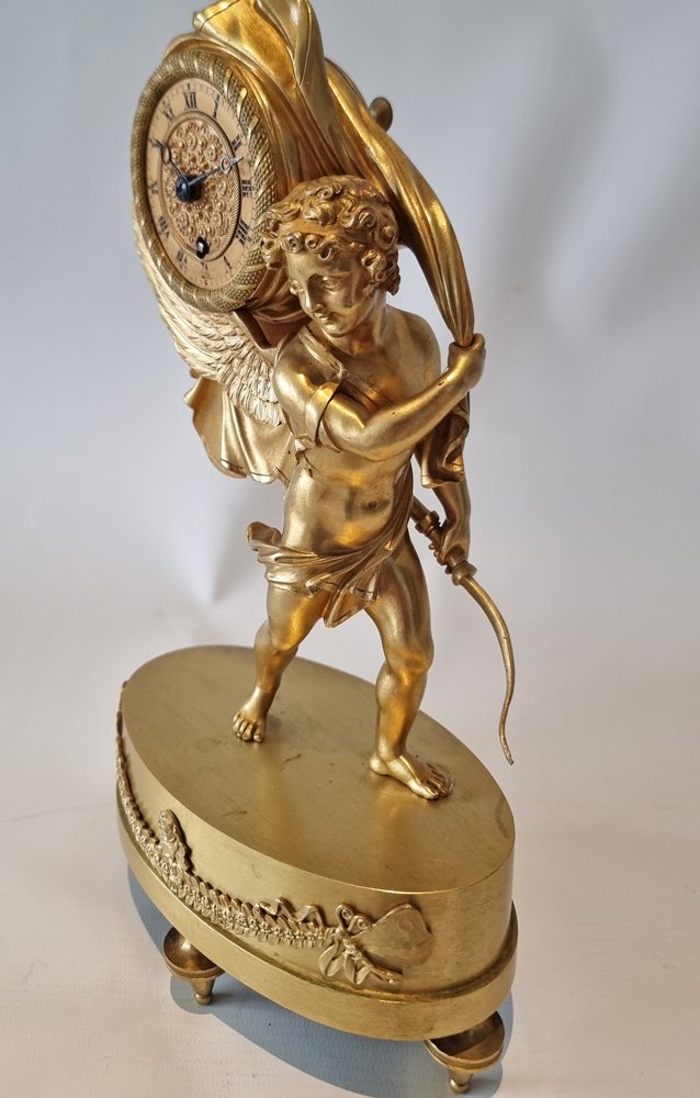 French Charles X miniature mantel clock of Cupid carrying time