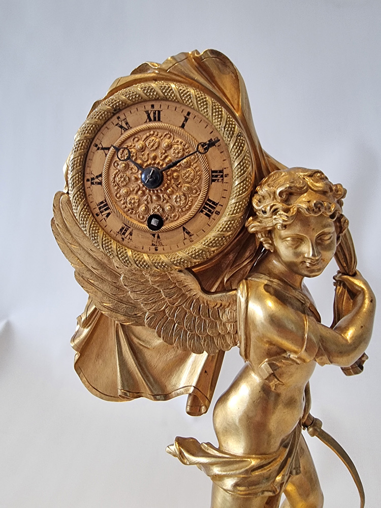 French Charles X miniature mantel clock of Cupid carrying time