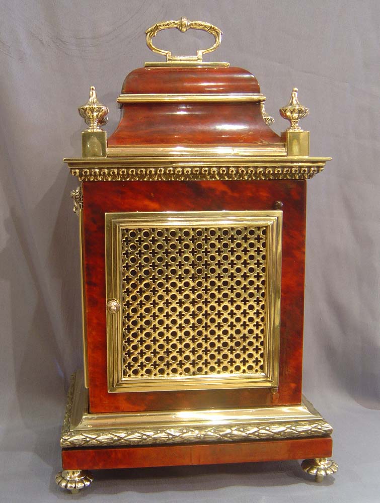 Antique French scarlet stained tortoiseshell and gilt bronze mantel clock