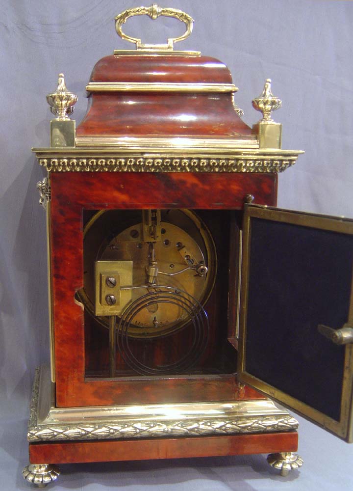 Antique French scarlet stained tortoiseshell and gilt bronze mantel clock