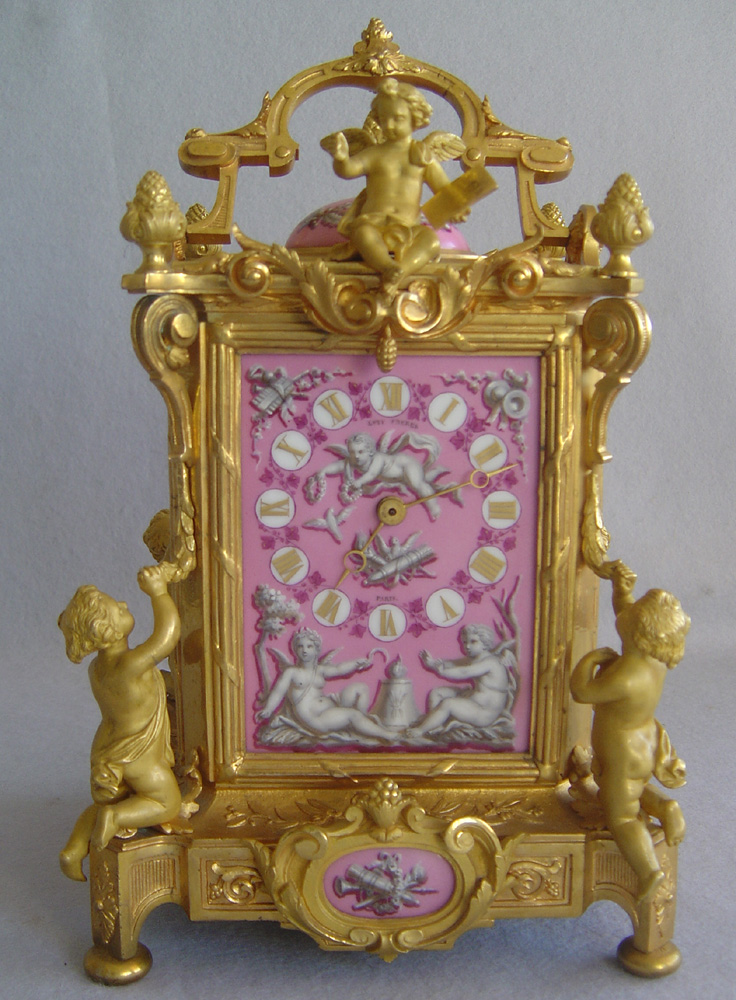 Antique French clock in pink porcelain and ormolu by Levy