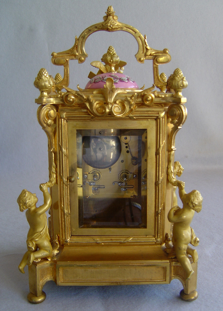 Antique French clock in pink porcelain and ormolu by Levy
