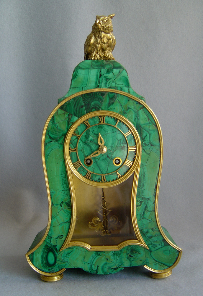 Antique Russian mantel clock veneered in Siberian malachite.