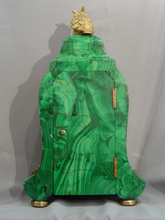 Antique Russian mantel clock veneered in Siberian malachite.