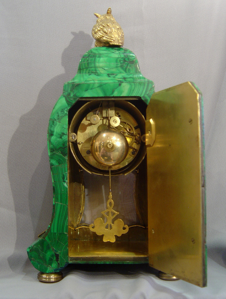 Antique Russian mantel clock veneered in Siberian malachite.