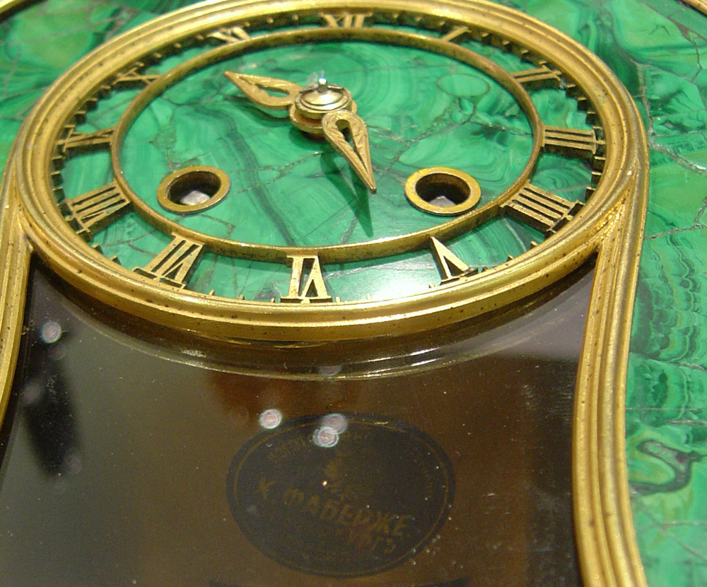 Antique Russian mantel clock veneered in Siberian malachite.