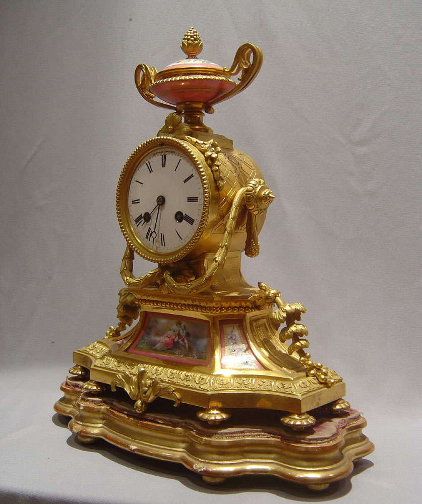 French antique pink porcelain and ormolu mantel clock.