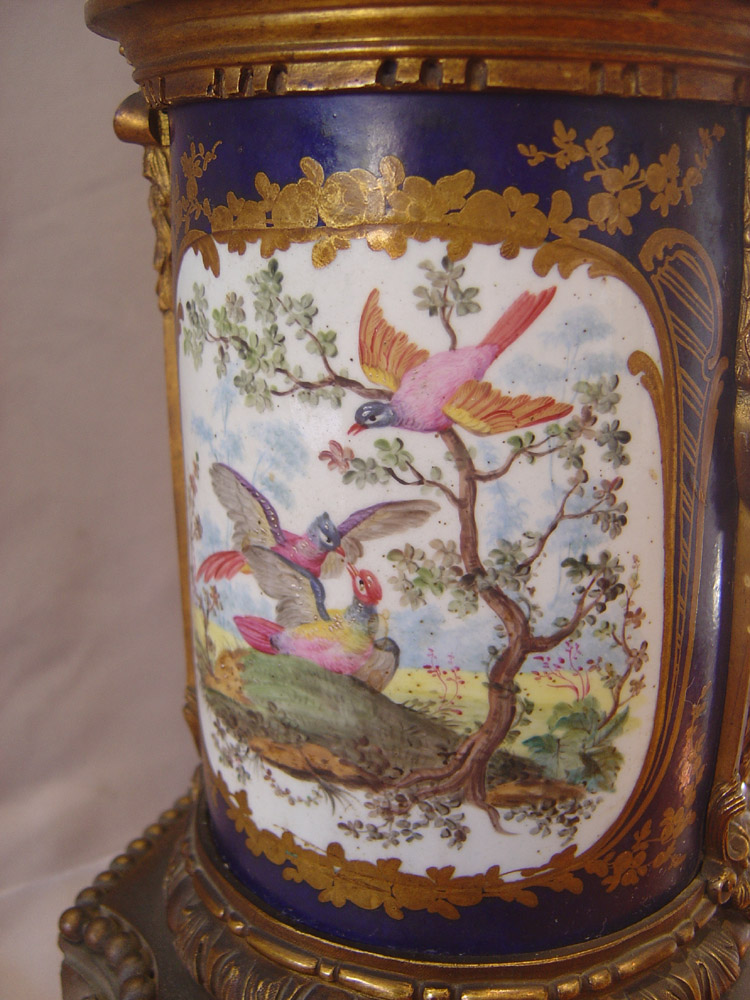 Antique French porcelain and ormolu mantle clock with painting after Boucher.