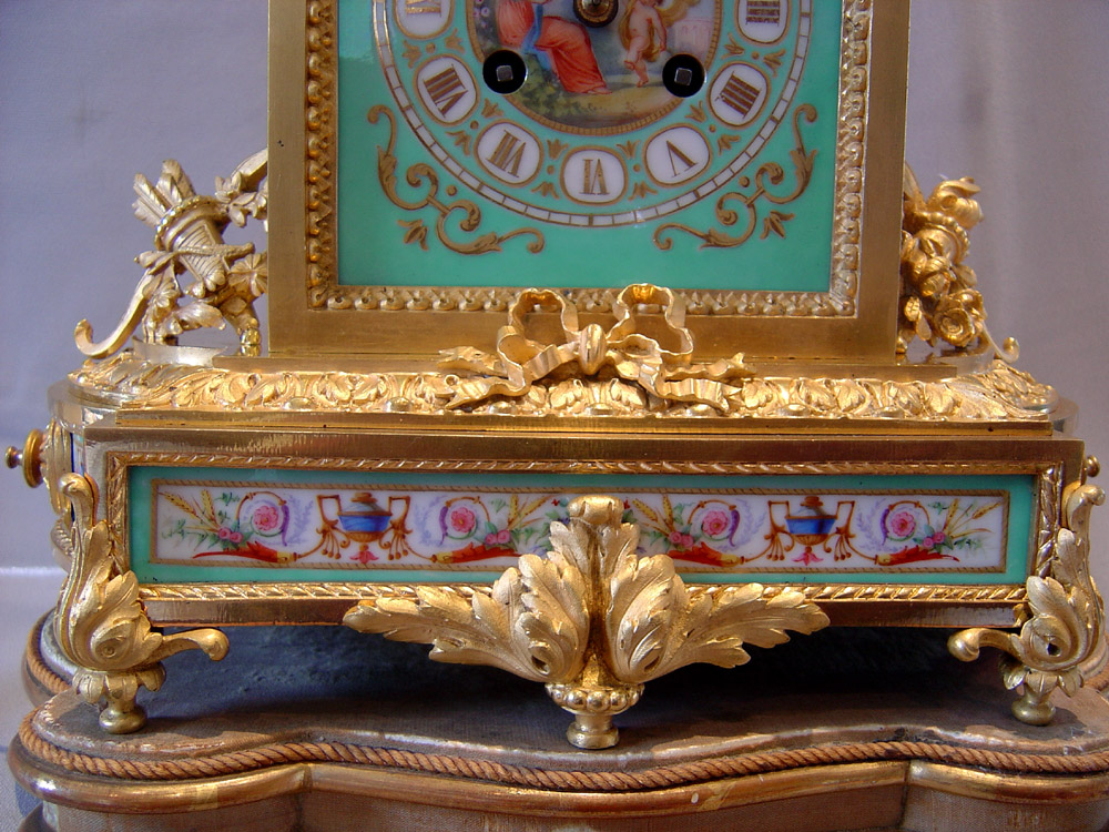 Antique French turquoise porcelain and ormolu mantel clock.