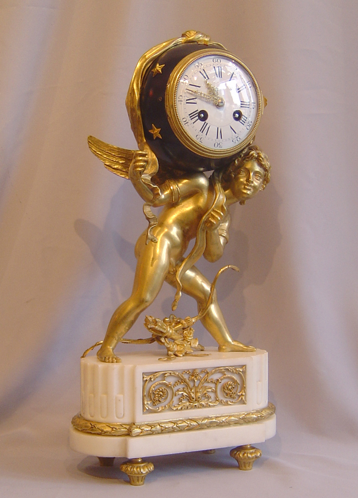 French antique Napoleon III mantel clock of Cupid carrying time.