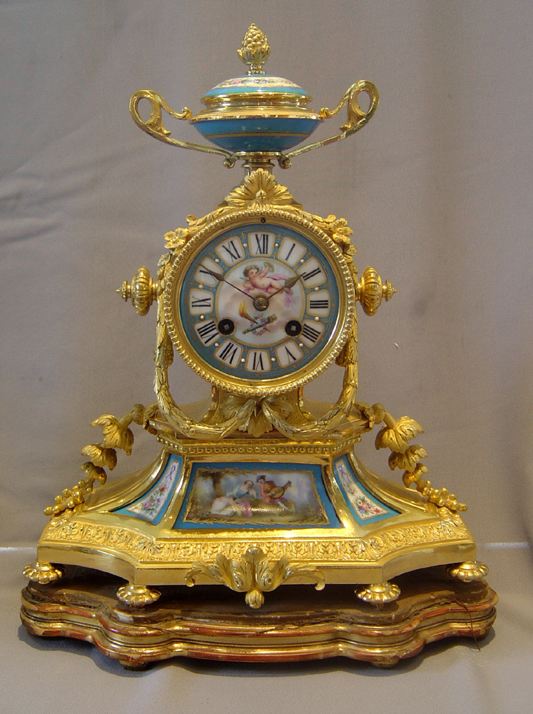 French antique ormolu and porcelain mantel clock.