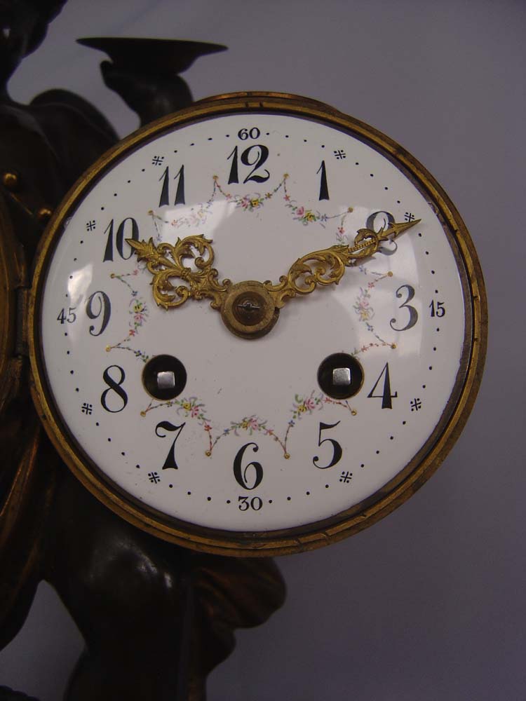 Antique clock French patinated and gilt bronze with griotte marble of Cupid playing drum and cymbal.