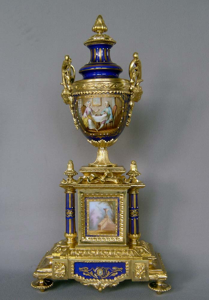 Antique French clock garniture in bleu du roi porcelain and ormolu.