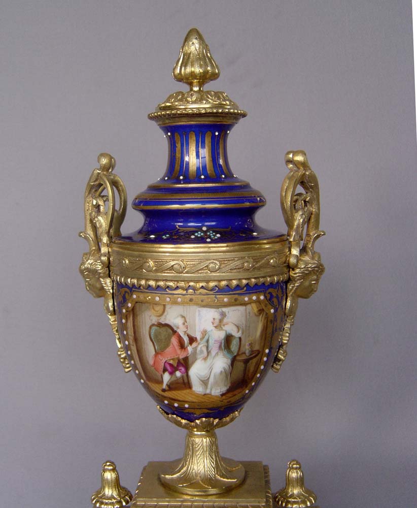 Antique French clock garniture in bleu du roi porcelain and ormolu.