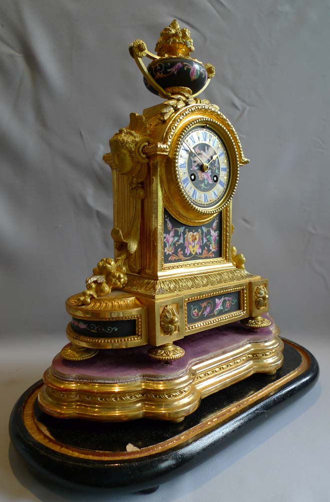 Antique mantel clock in ormolu and porcelain clock under dome.Achille Brocot