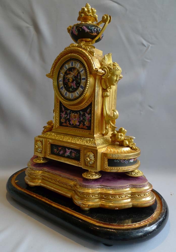 Antique mantel clock in ormolu and porcelain clock under dome.Achille Brocot