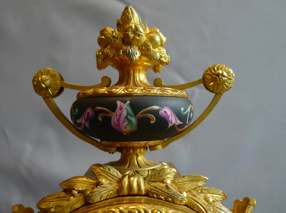 Antique mantel clock in ormolu and porcelain clock under dome.Achille Brocot
