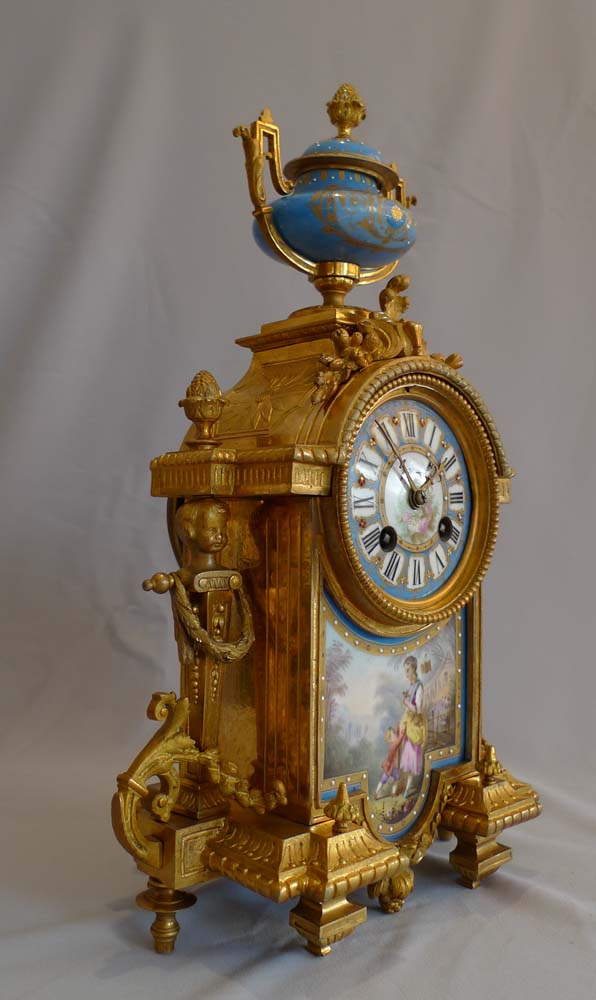 Antique French porcelain and ormolu mantel clock.