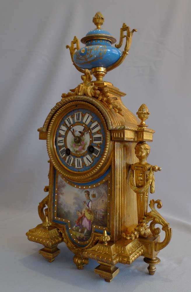 Antique French porcelain and ormolu mantel clock.