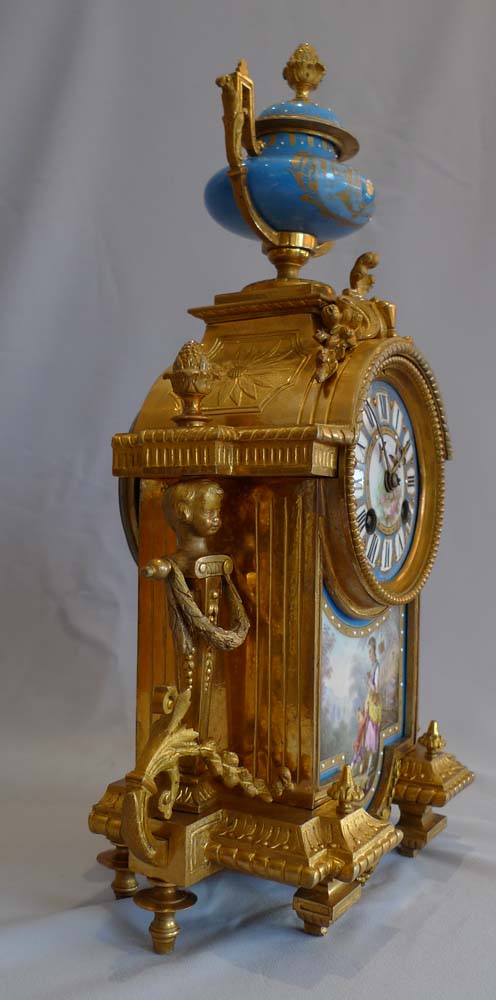 Antique French porcelain and ormolu mantel clock.