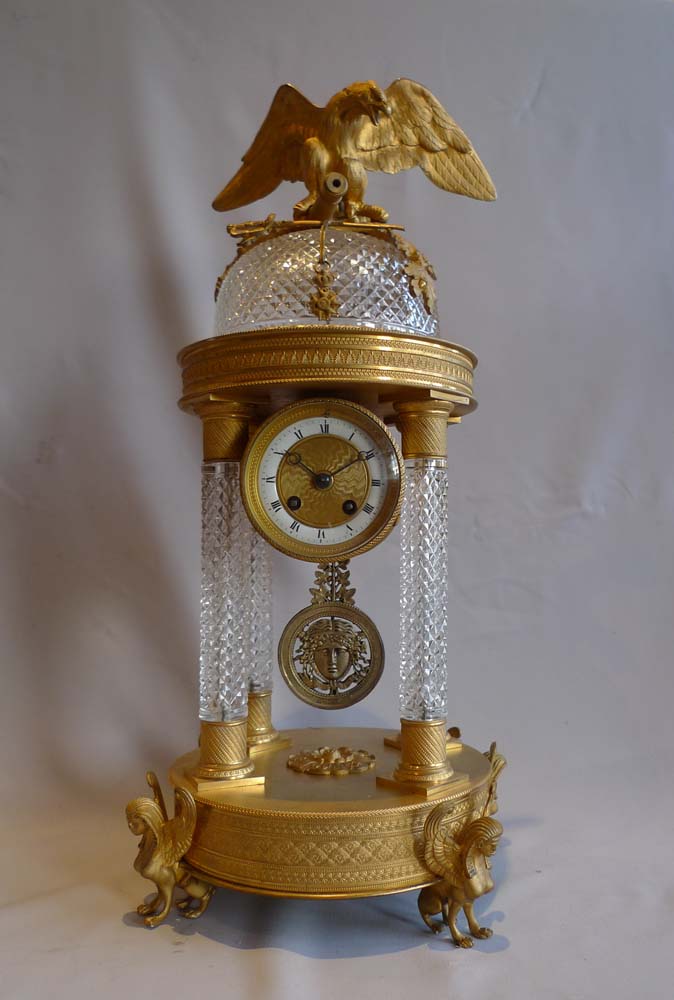 Antique crystal and bronze mantel clock with Napoleonic trophies