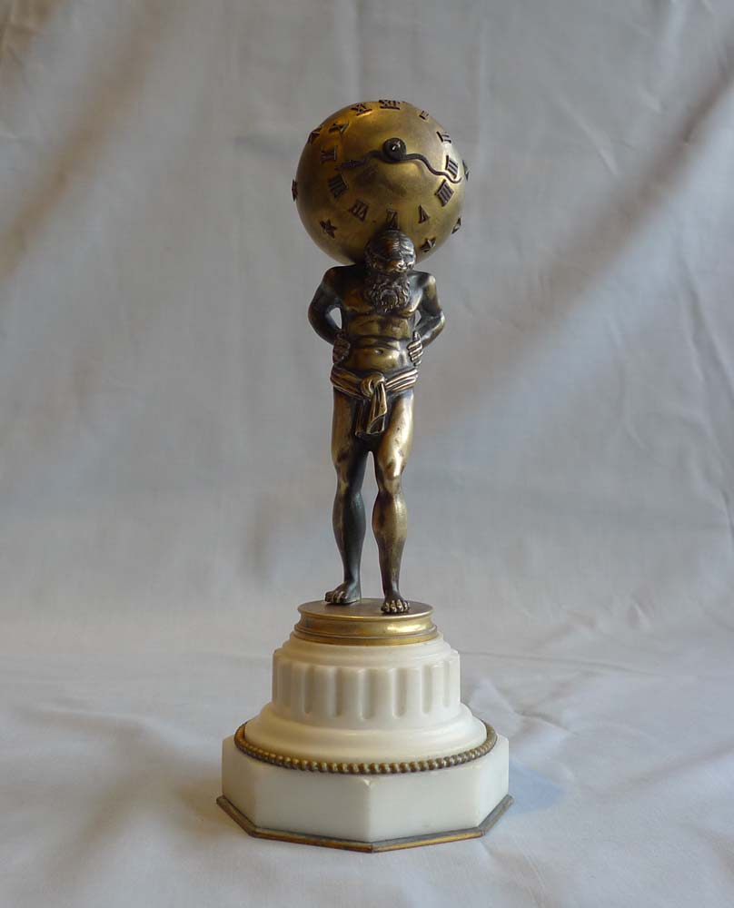 Miniature marble, ormolu and patinated bronze clock of Atlas holding up the heavens.