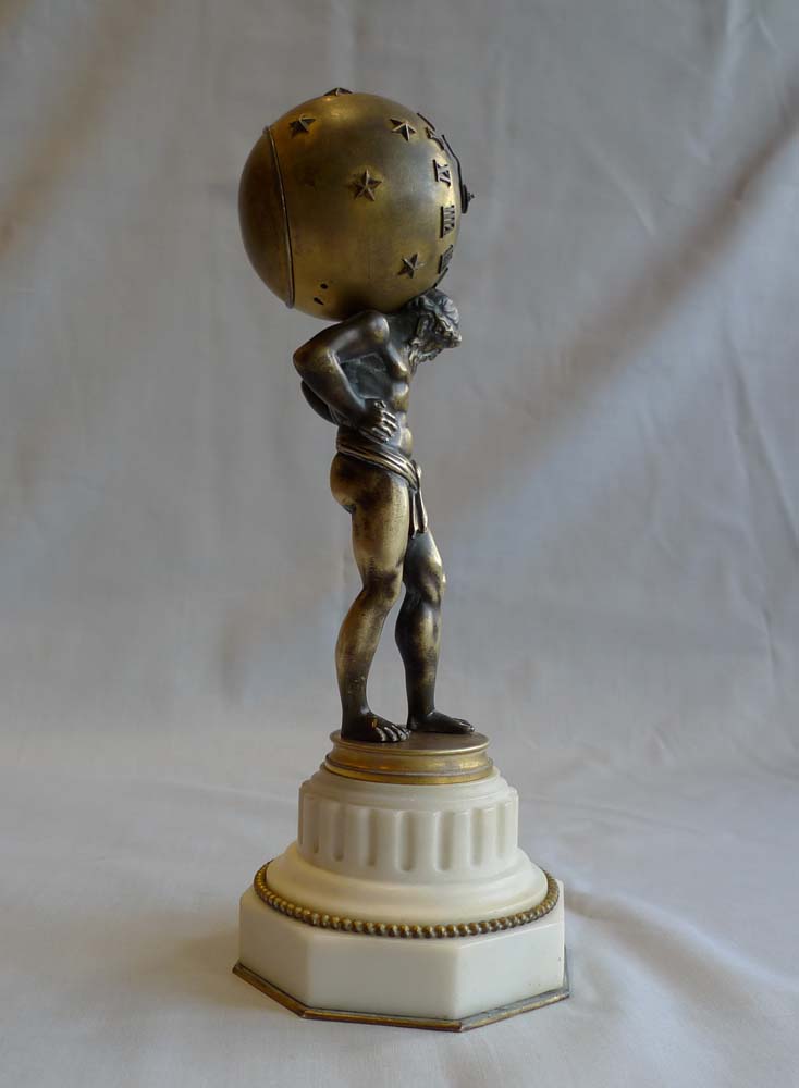 Miniature marble, ormolu and patinated bronze clock of Atlas holding up the heavens.