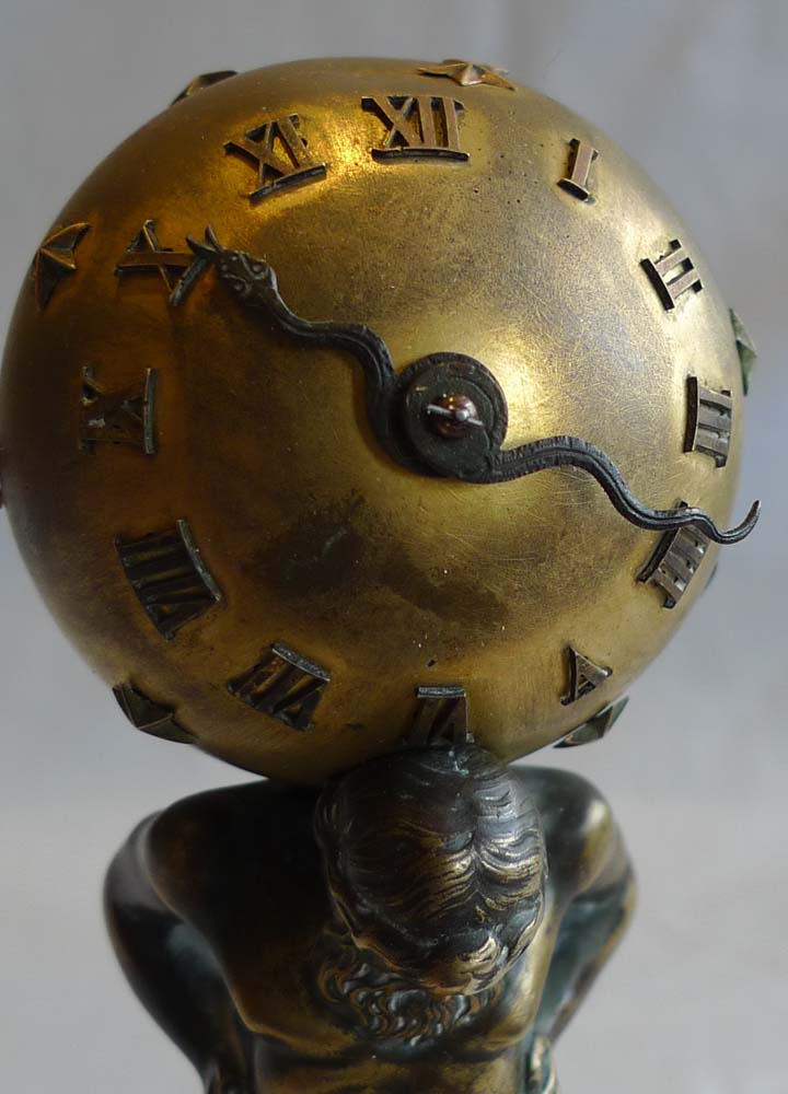 Miniature marble, ormolu and patinated bronze clock of Atlas holding up the heavens.