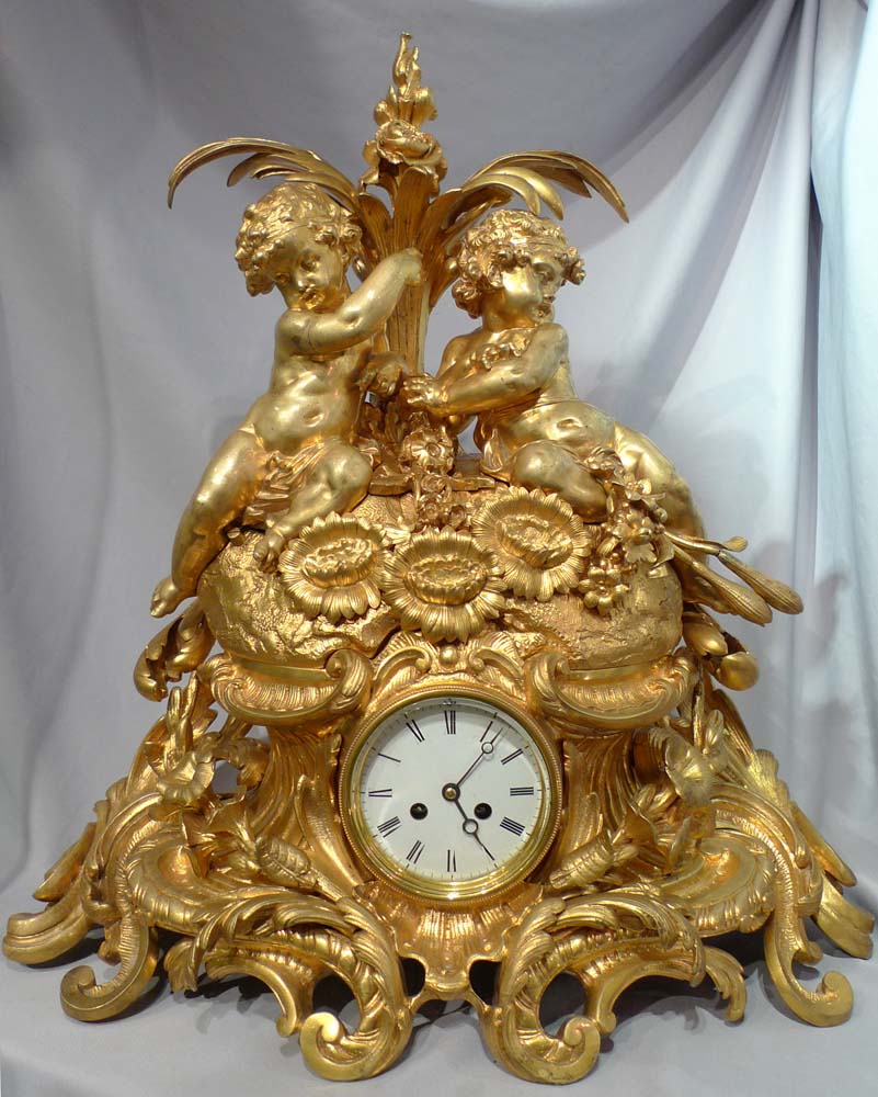 Antique French Victorian or Napoleon III large ormolu mantel clock with cherubs.