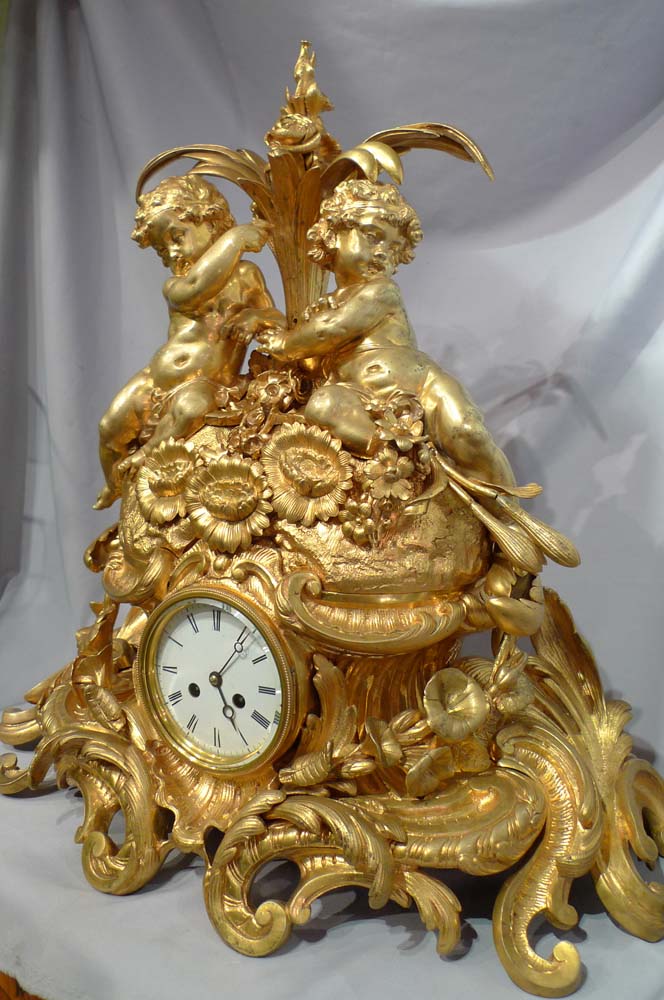 Antique French Victorian or Napoleon III large ormolu mantel clock with cherubs.