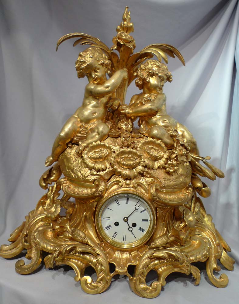 Antique French Victorian or Napoleon III large ormolu mantel clock with cherubs.