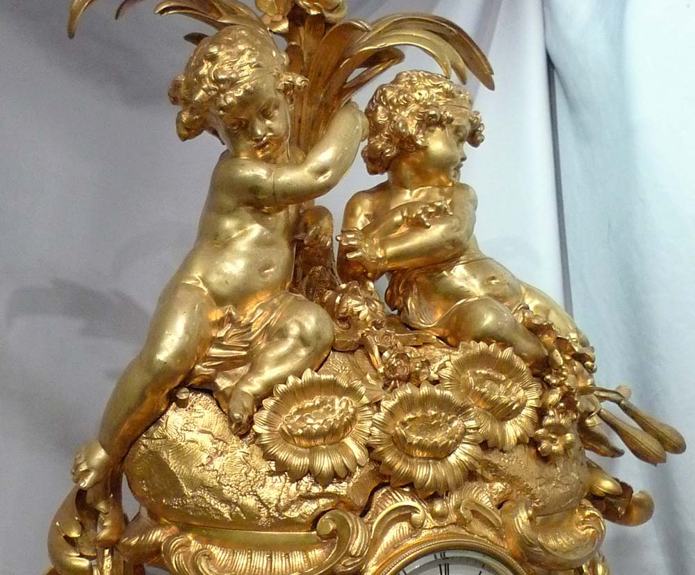 Antique French Victorian or Napoleon III large ormolu mantel clock with cherubs.