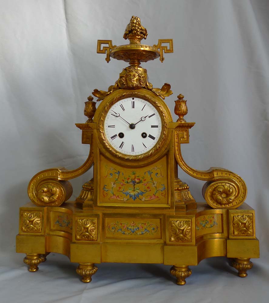 Antique French porcelain and ormolu mantel clock stamped in bronze H. Picard. And numbered