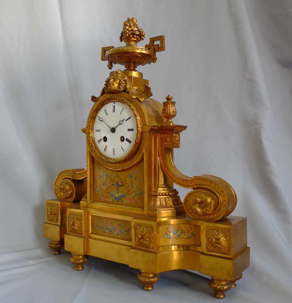 Antique French porcelain and ormolu mantel clock stamped in bronze H. Picard. And numbered